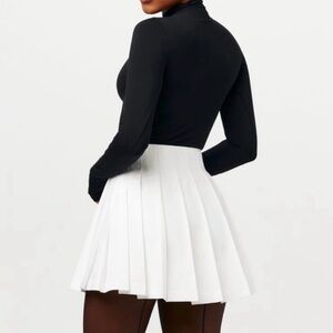 Naked Wardrobe • Plated A-Line mini skirt
